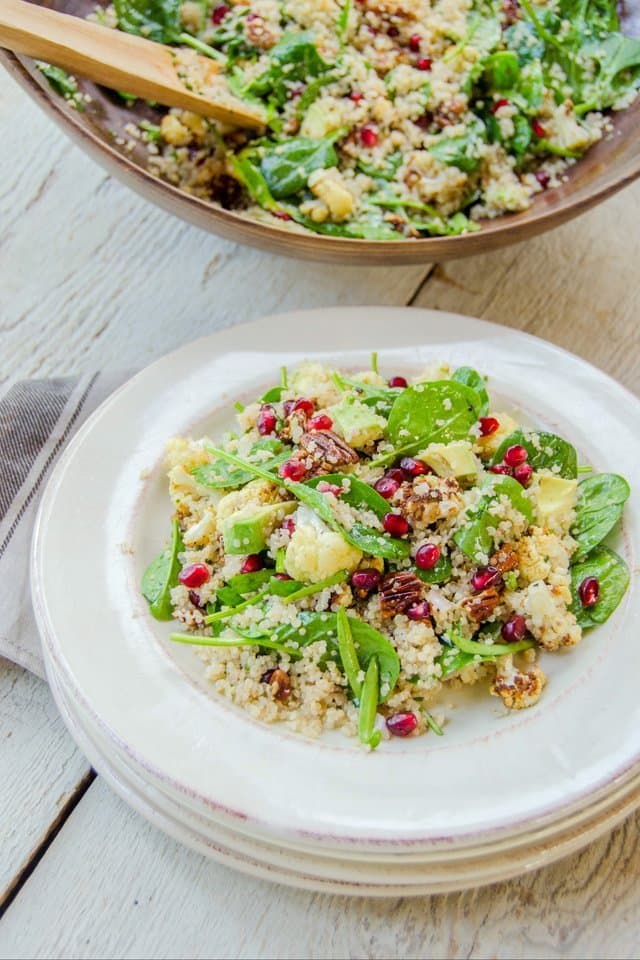 Quinoa and Spinach Salad with Roasted Cauliflower, Pecans, Avocado and Pomegranate Seeds