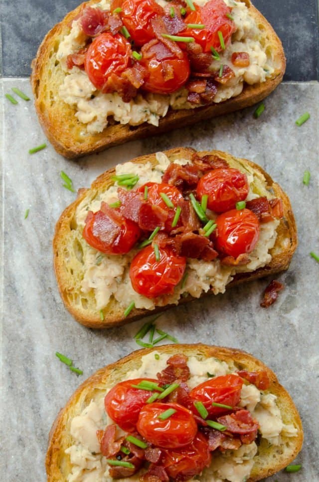 White Bean Toasts with Burst Grape Tomatoes and Pancetta