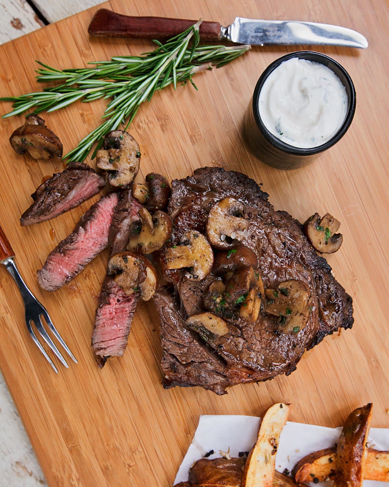 Marinated Rib-Eye Steak with Herb Roasted Mushrooms
