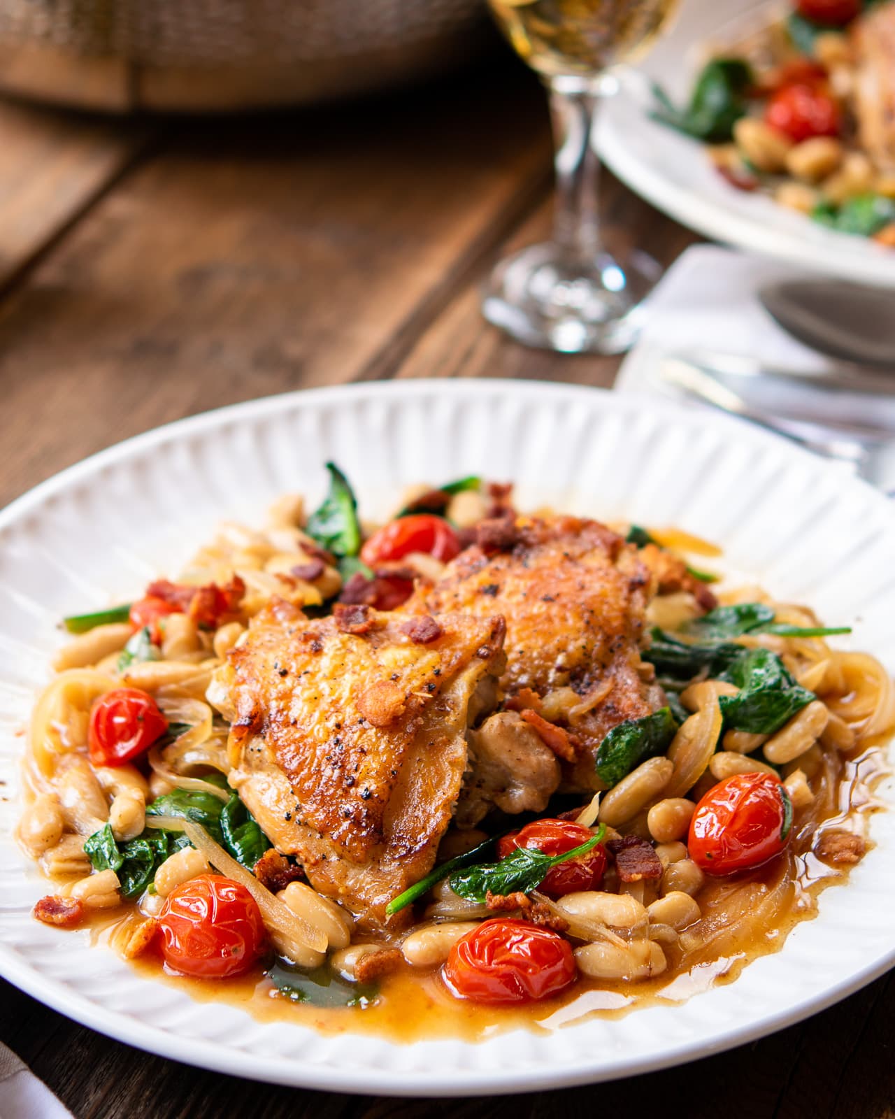 Crispy Chicken Thighs with White Beans, Tomatoes & Spinach