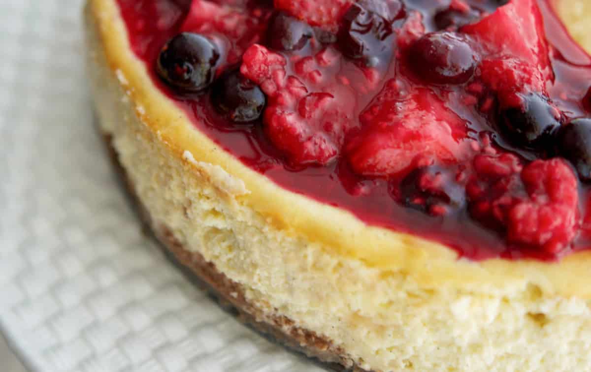 Vanilla Bean Cheesecake with Mixed Berry Compote
