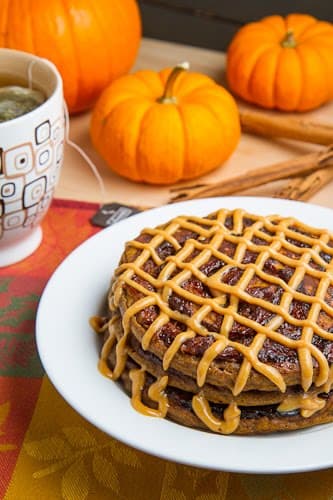 Pumpkin Cinnamon Roll Pancakes with Caramel Cream Cheese Frosting